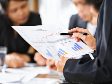 Businessman holding stats and figures